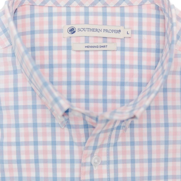 A Henning Shirt: Freret, with a blue and pink checkered pattern, featuring a button-down design.