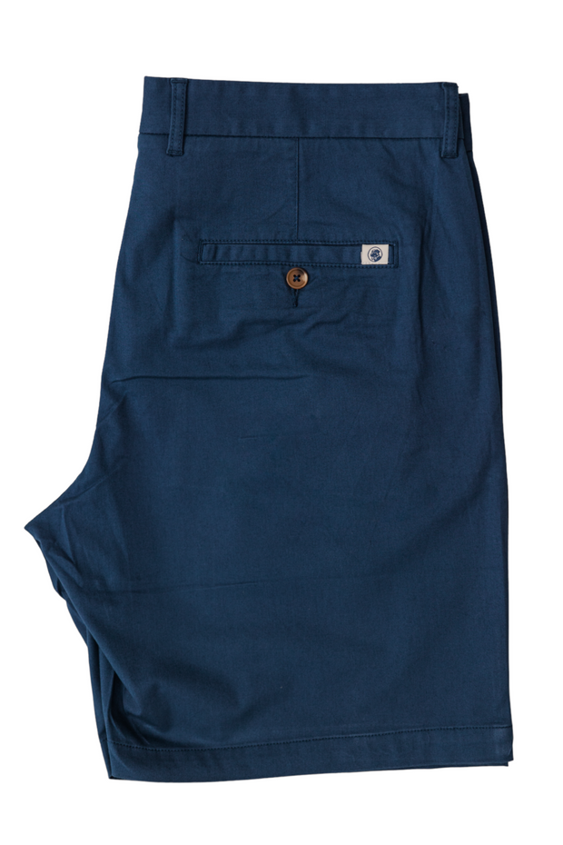 The men's blue Bluff Twill Short chino shorts on a white background can be replaced with the product name "Bluff Short: Proper Navy.