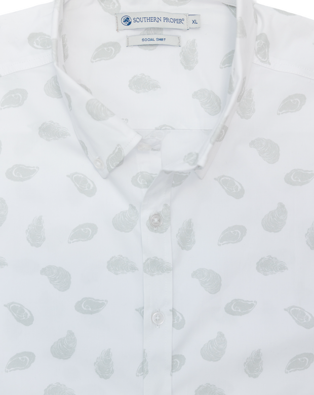 A white Cocktail Shirt: Oyster Shuck with a grey paisley print, featuring a tailored fit.