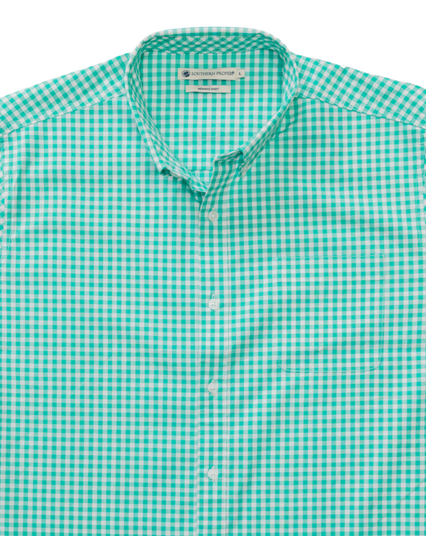 A St. Charles woven gingham dress shirt in Caribbean Green and white on a white background.