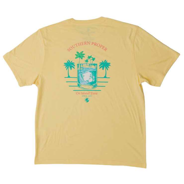 A yellow short sleeve Island Time SS Tee with a printed logo of palm trees, made from Peruvian fabric.