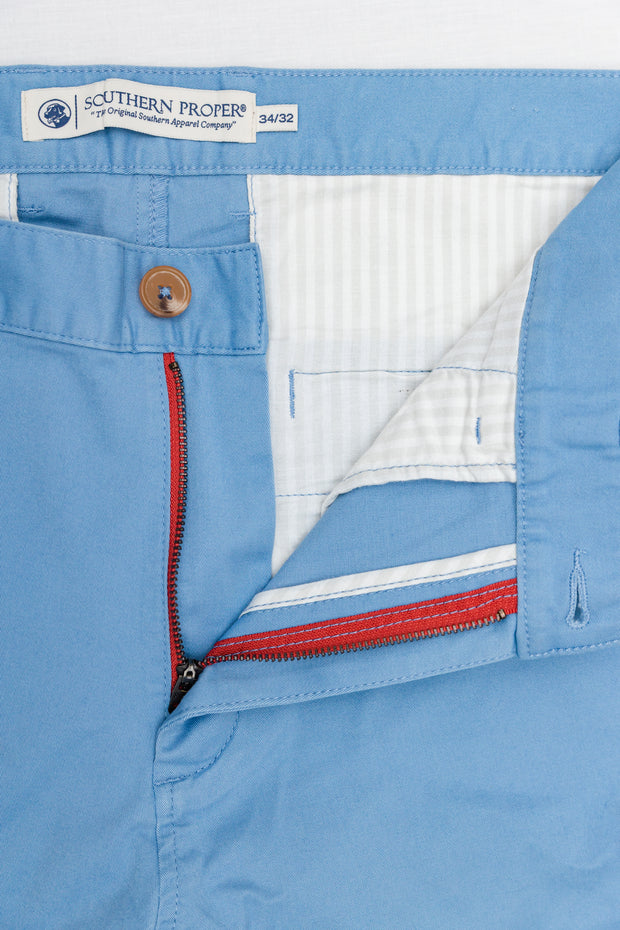 A pair of Thomasville blue chino pants with a zippered pocket.