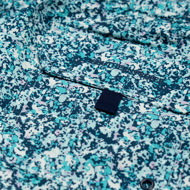 A close up of a Southern Swim 7.5" Splatter Camo shirt with conversation starting patterns.