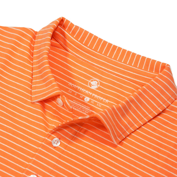 An orange and white Perdido Stripe Polo polo shirt.