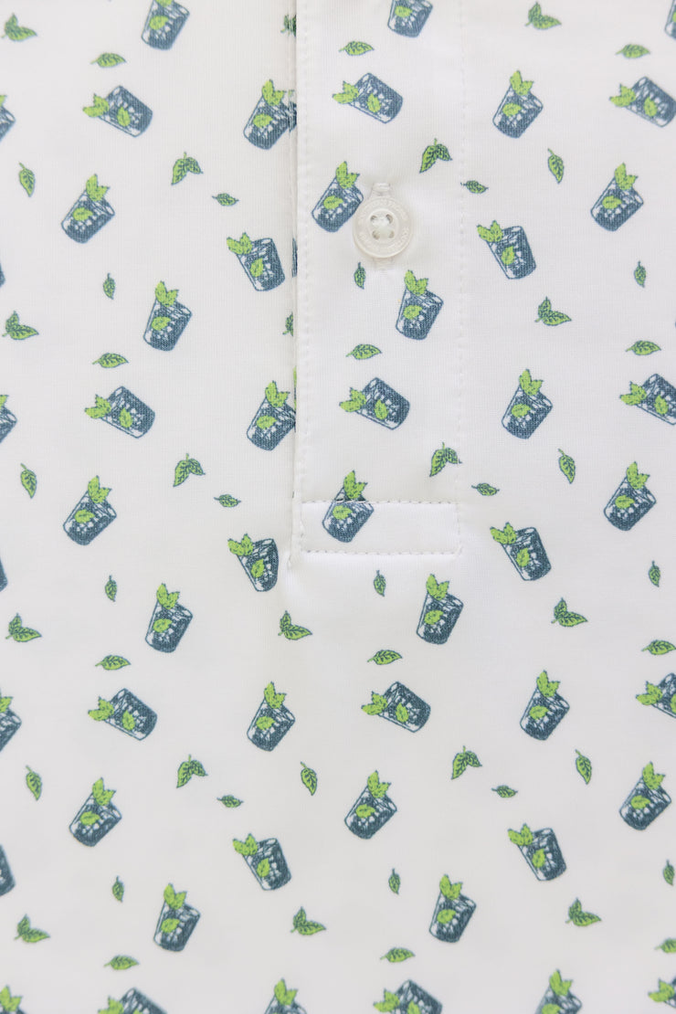 A white Mint Julep Printed Performance Polo with green leaves on it, perfect for the Kentucky Derby or sipping a Mint Julep.