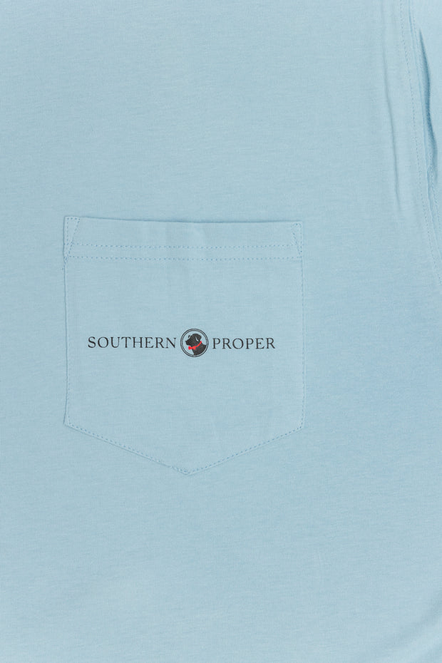 A light blue Dog Days Tee: Oxford Blue with a printed front pocket that says "Southern Grower.