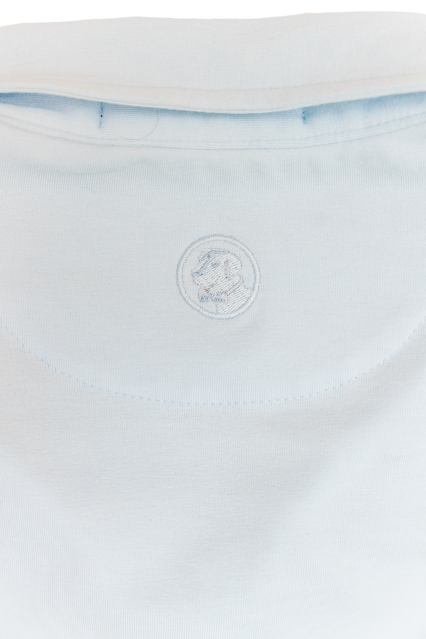 The back of a blue Magnolipolo shirt with a logo on it.