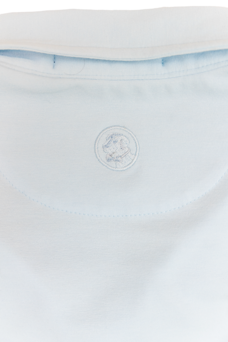 The back of a blue Magnolipolo shirt with a logo on it.