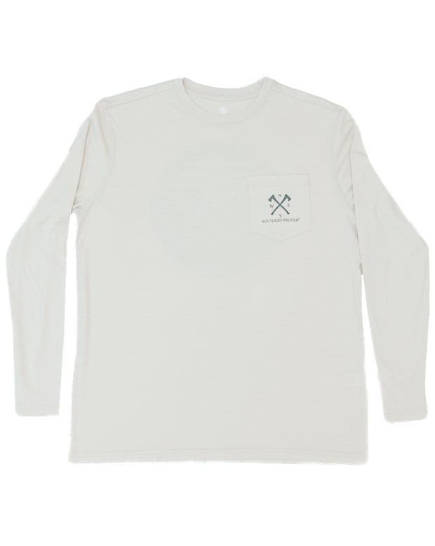 A white Walk in the Woods LS Tee - Proper Grey with a cross printed logo on it.