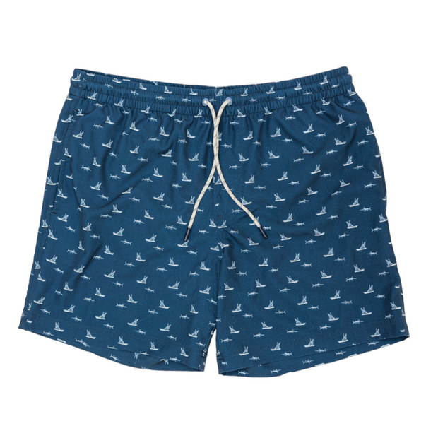 The Chasing Blues Swim: Navy feature a vibrant blue color adorned with playful white birds, perfect for any beach or pool occasion in the Florida Keys.