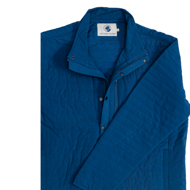 A versatile Quilted Field Jacket, featuring a blue color, showcased elegantly on a white background.