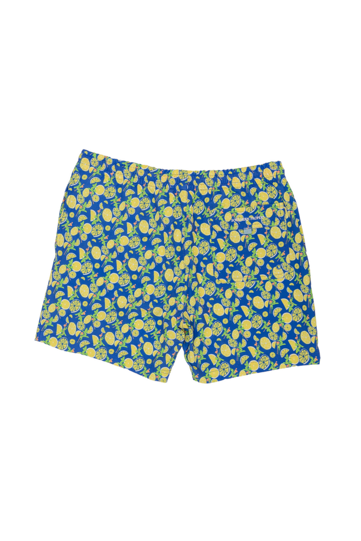 Introducing our Just Add Lemons Swim: Nautical Blue swim trunks, featuring a vibrant lemon print on a blue and yellow design. These trunks are crafted with a soft mesh liner for utmost comfort.