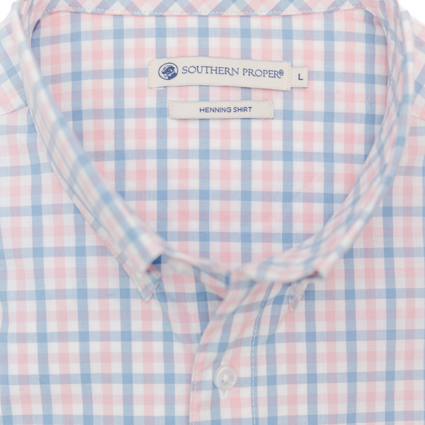 A Henning Shirt: Freret, with a blue and pink checkered pattern, featuring a button-down design.