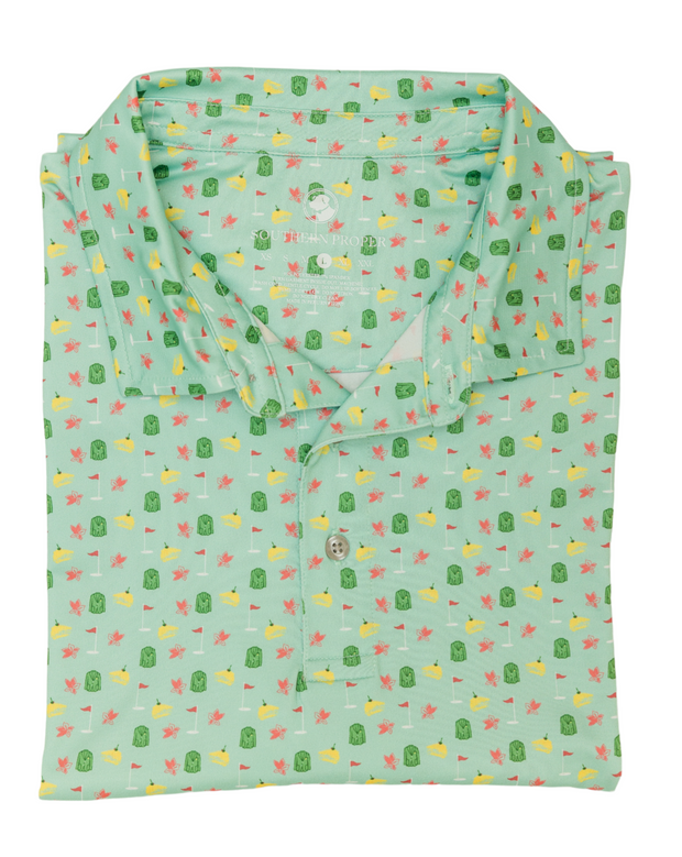 A mint green Azalea printed performance polo shirt with polka dots, made with moisture-wicking fabric.