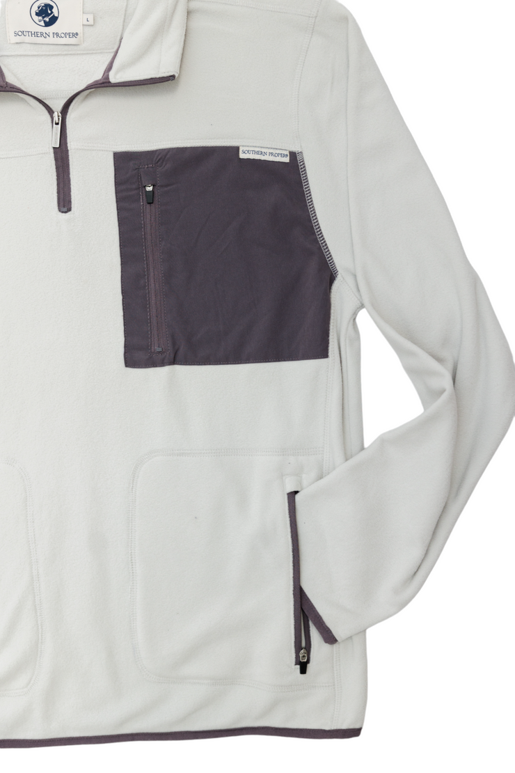The men's white and gray All Prep Fleece Pullover perfect for a golf swing.