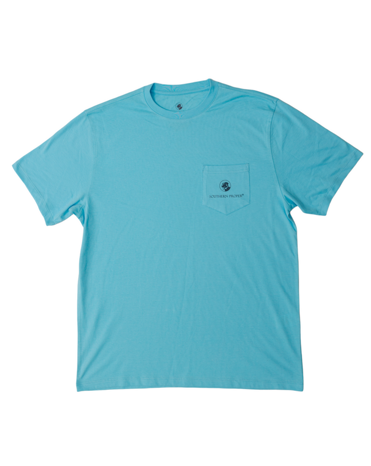 A Southern Proper Beach Signs SS Tee - Canal Blue with a printed logo on the front.
