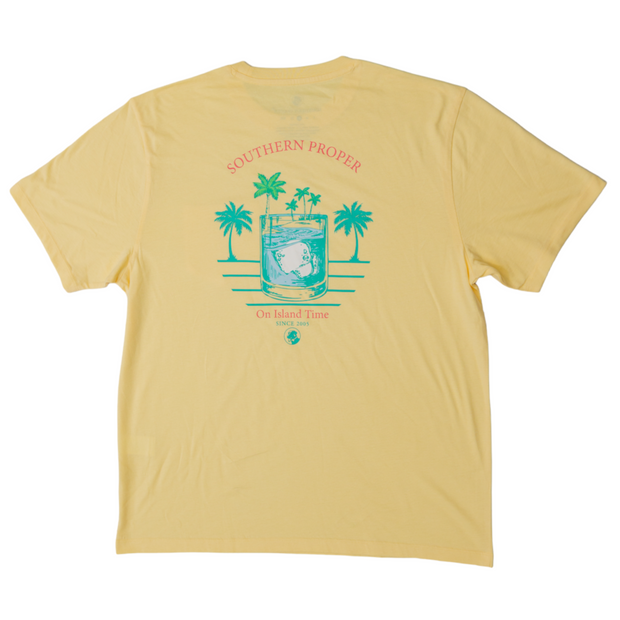 A yellow short sleeve Island Time SS Tee with a printed logo of palm trees, made from Peruvian fabric.