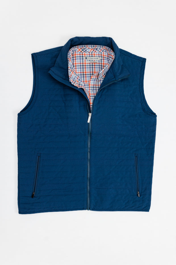 A blue Quilted Field Vest.
