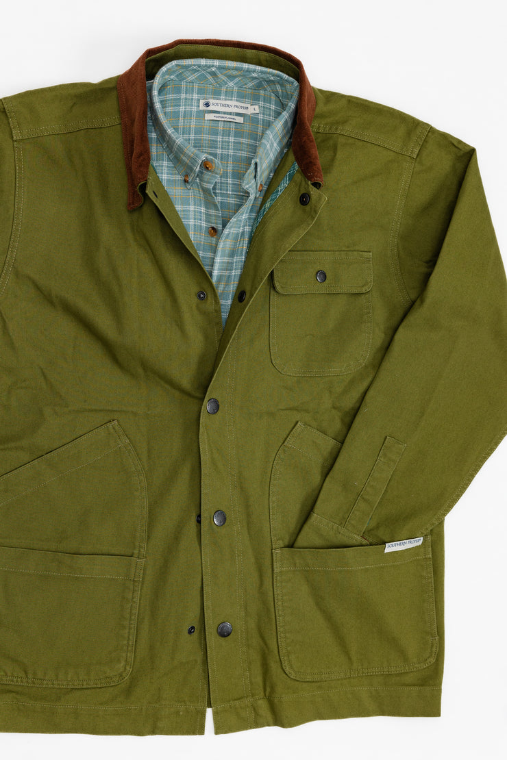 Bluff Barn Jacket, a green jacket with a plaid collar, made of cotton canvas.