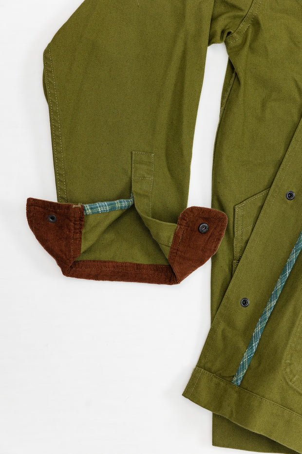 A [Bluff Barn Jacket], made of cotton canvas, with a brown lining.