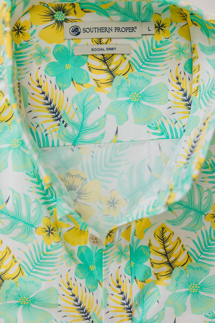 A close up of a Cocktail Shirt: Key West with a tropical print and short sleeves.
