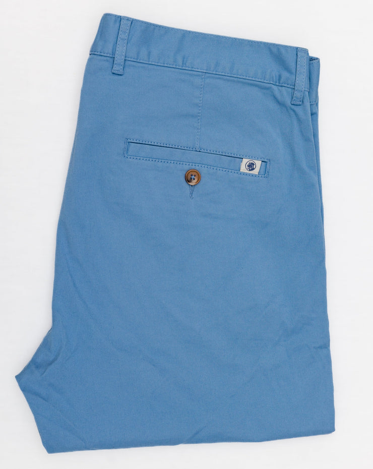 A pair of Thomasville pants on a white surface.