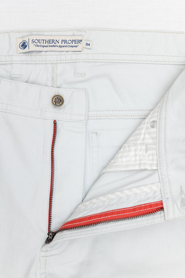 A pair of Needle Creek Five Pocket Pants with red zippers featuring a classic straight leg fit.