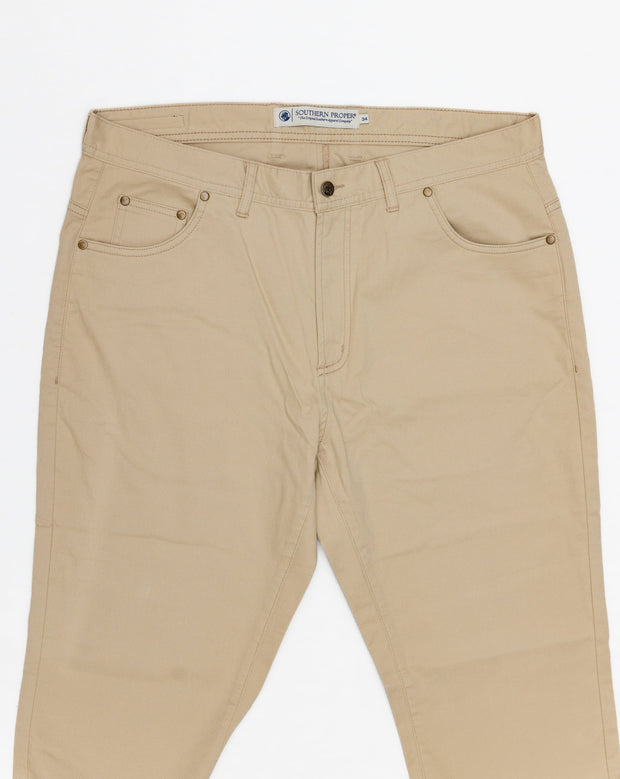 A pair of Needle Creek Five Pocket Pant tan pants on a white background.