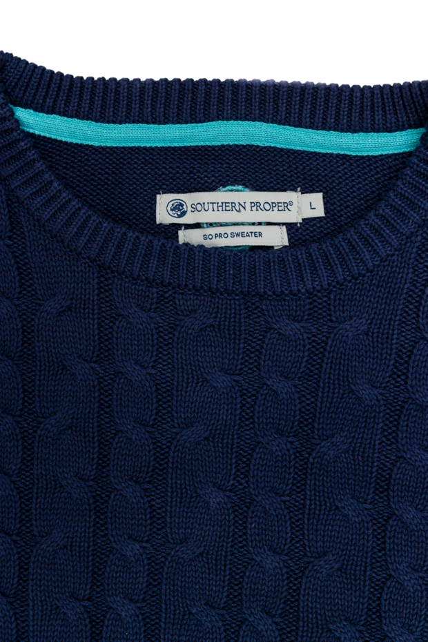 Dress up in the men's navy SoPro Cable Sweater with embroidered SP Logo.