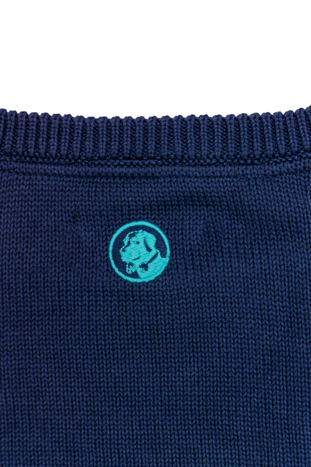 A SoPro Cable sweater with an embroidered SP logo on the back.