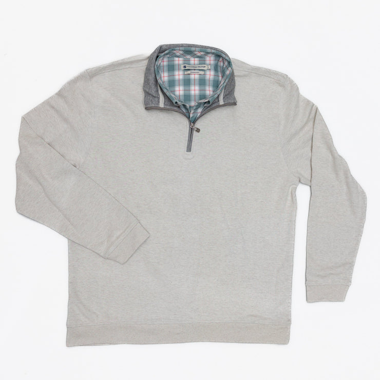 The Canal Quarter Zip is a men's sweater with a checkered pattern, crafted from heathered delta washed fabric for a stylish and comfortable look.