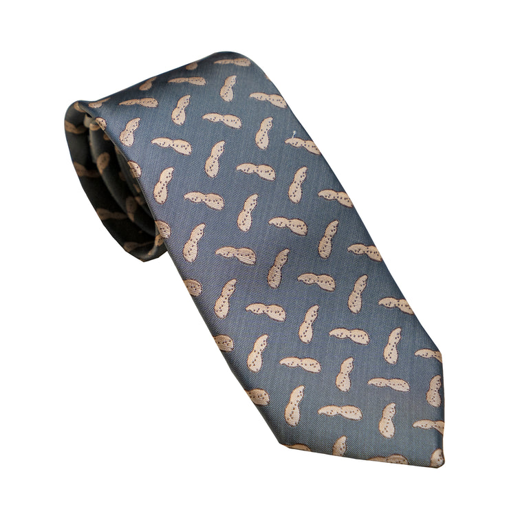 A Southern Proper SP Necktie - Peanut with a pair of Peanut flip flops on it.