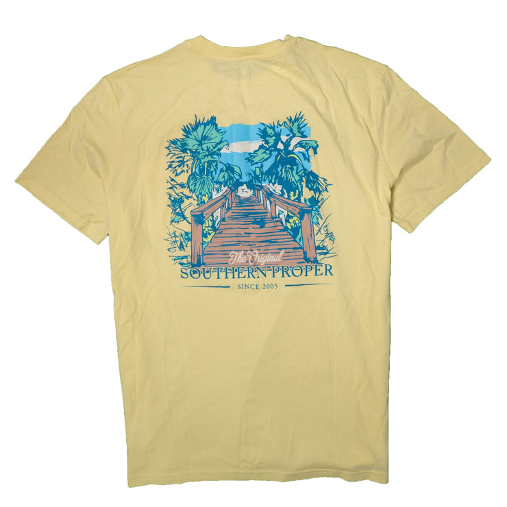 A yellow Beach Walk SS Tee with a printed palm tree logo on it.