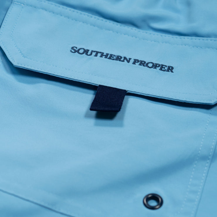 A close up of a blue pocket with the word Southern Swim - Solid on it.