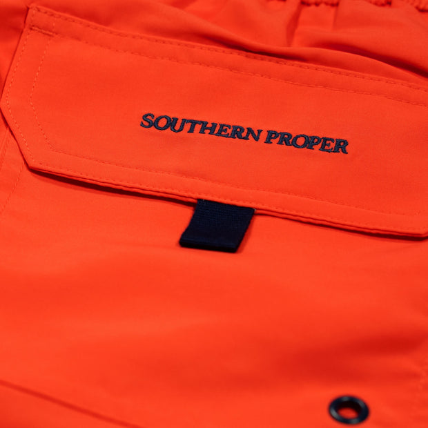 A close up image of a pocket with the words Southern Swim 5.5" on it, featuring an elastic waistband and a nylon mesh liner.