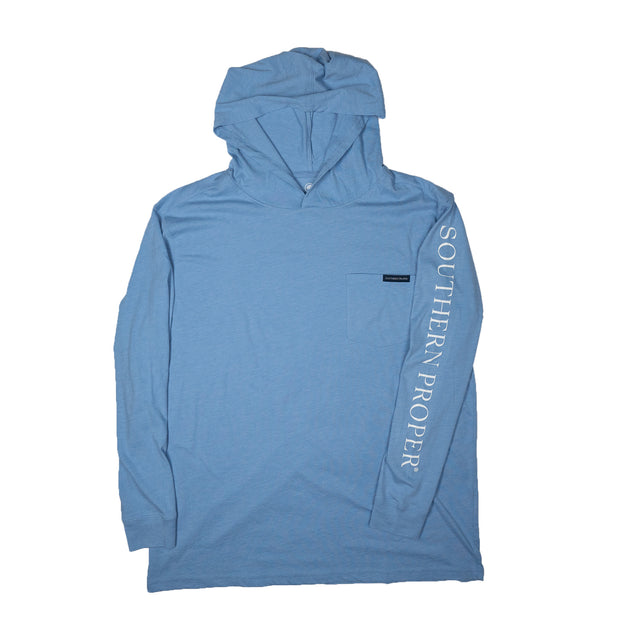 A Southern Proper Hoodie Tee: Coastal Blue, made from Peruvian Cotton, featuring the word "south" on a blue long-sleeve design.