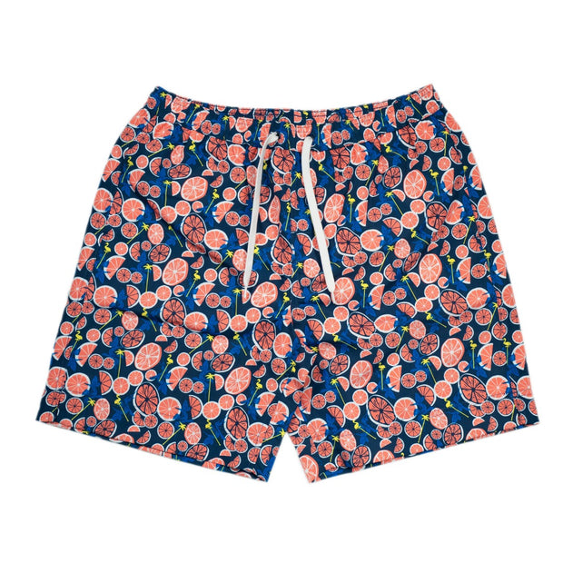 A navy blue and pink floral print beachside Southern Swim 7.5" shorts with a Hint of Orange.