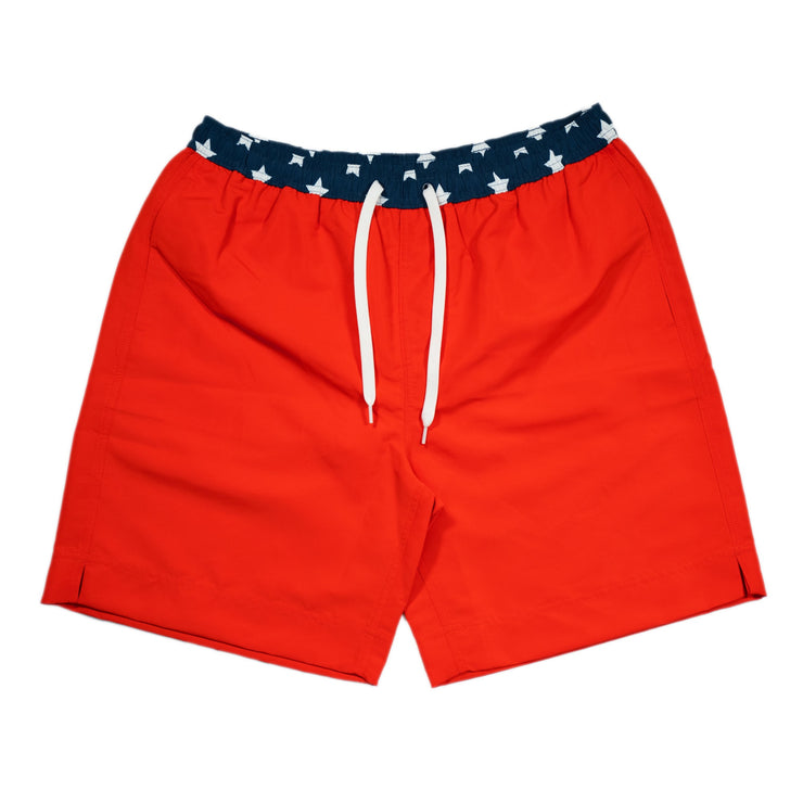 A pair of Southern Swim Solid swim shorts with navy and white stripes featuring an elastic waistband.