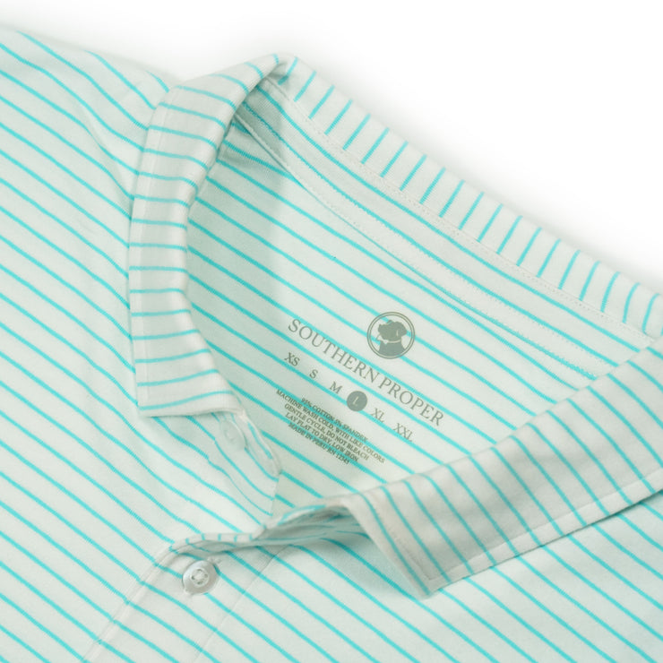A close up of the Perdido Stripe Polo's collar, showcasing its soft tees and cotton forward design.