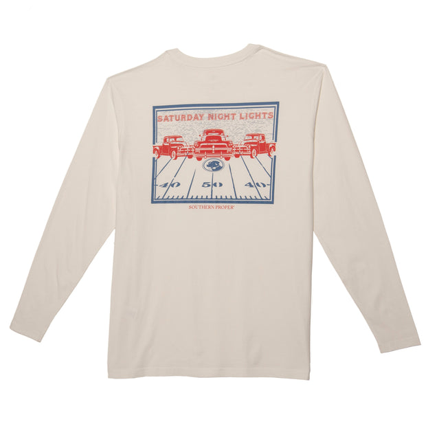 A white pre-washed Saturday Night Lights Long Sleeve Tee with a red, white and blue printed design.
