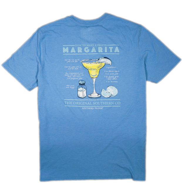 The Proper Margarita SS Tee is a soft blue shirt featuring an illustration of a margarita.