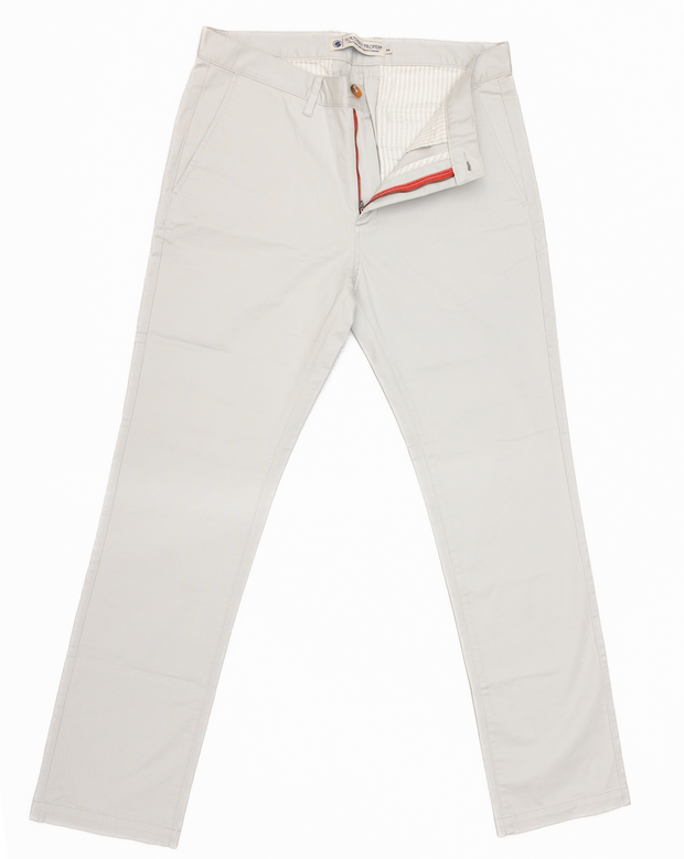 A white flat-front Thomasville Pant with a red stripe, featuring a tailored fit.